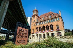 main street station in richmond virginia with sign and i-95 bridge